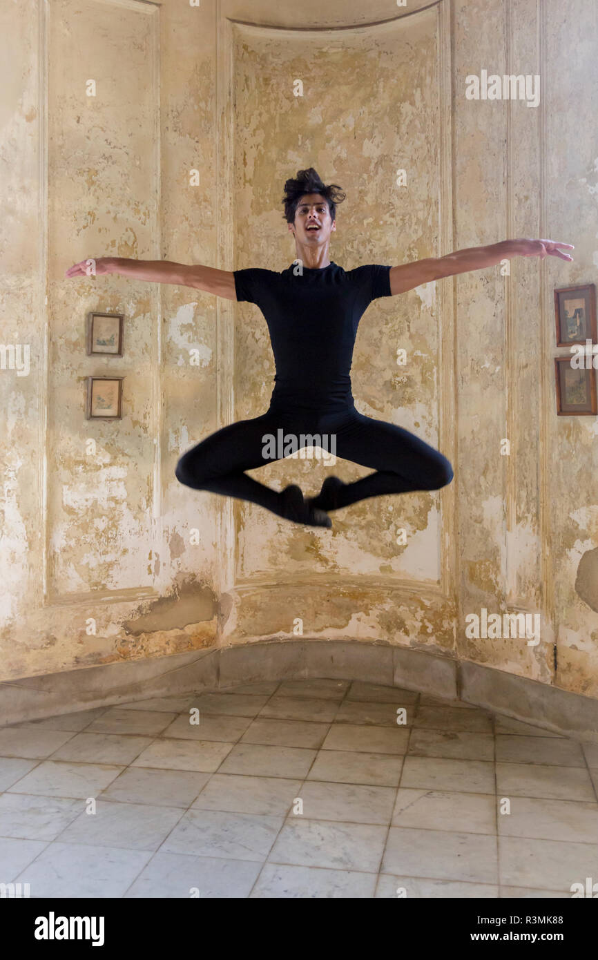 Cuba, Havana. Male dancer makes ballet move. Credit as: Wendy Kaveney / Jaynes Gallery / DanitaDelimont.com Stock Photo