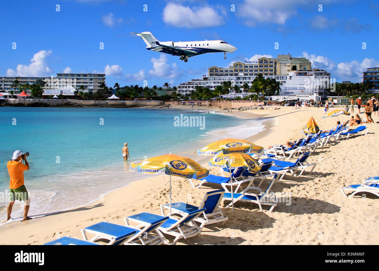 St. Martin, Netherland Antilles, Maho Beach. Private jet landing over the beach in St. Maarten