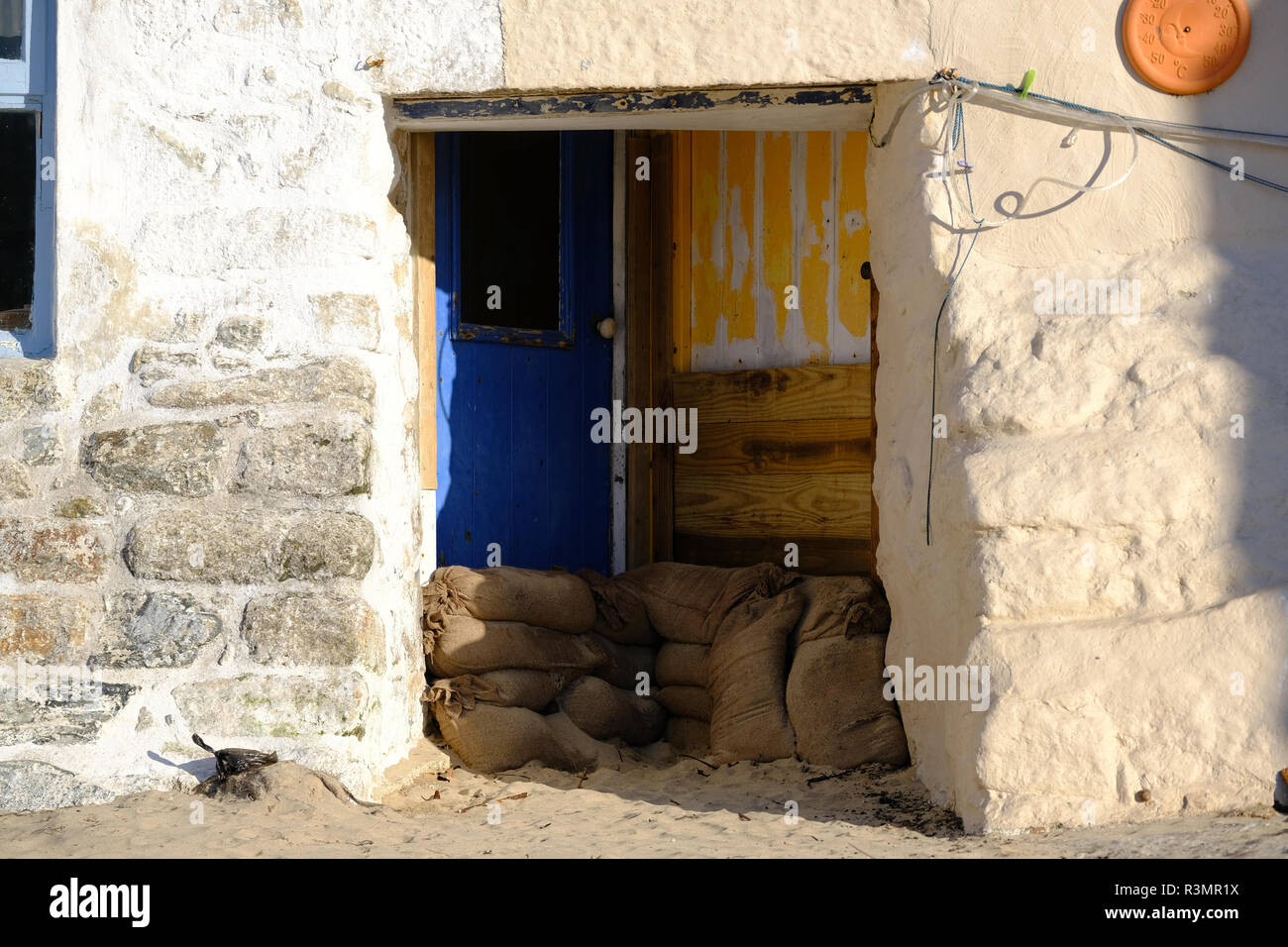 Sandbagged Doorway At Fishing Cottages On The Beach In St Ives