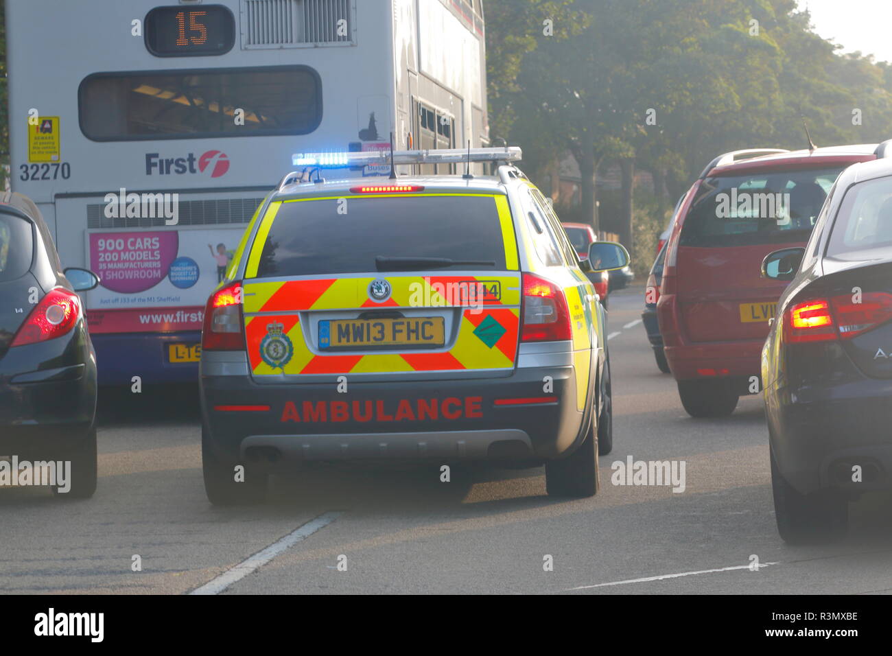 A paramedic vehicle battles to get through rush hour traffic to get to an emergency. Stock Photo