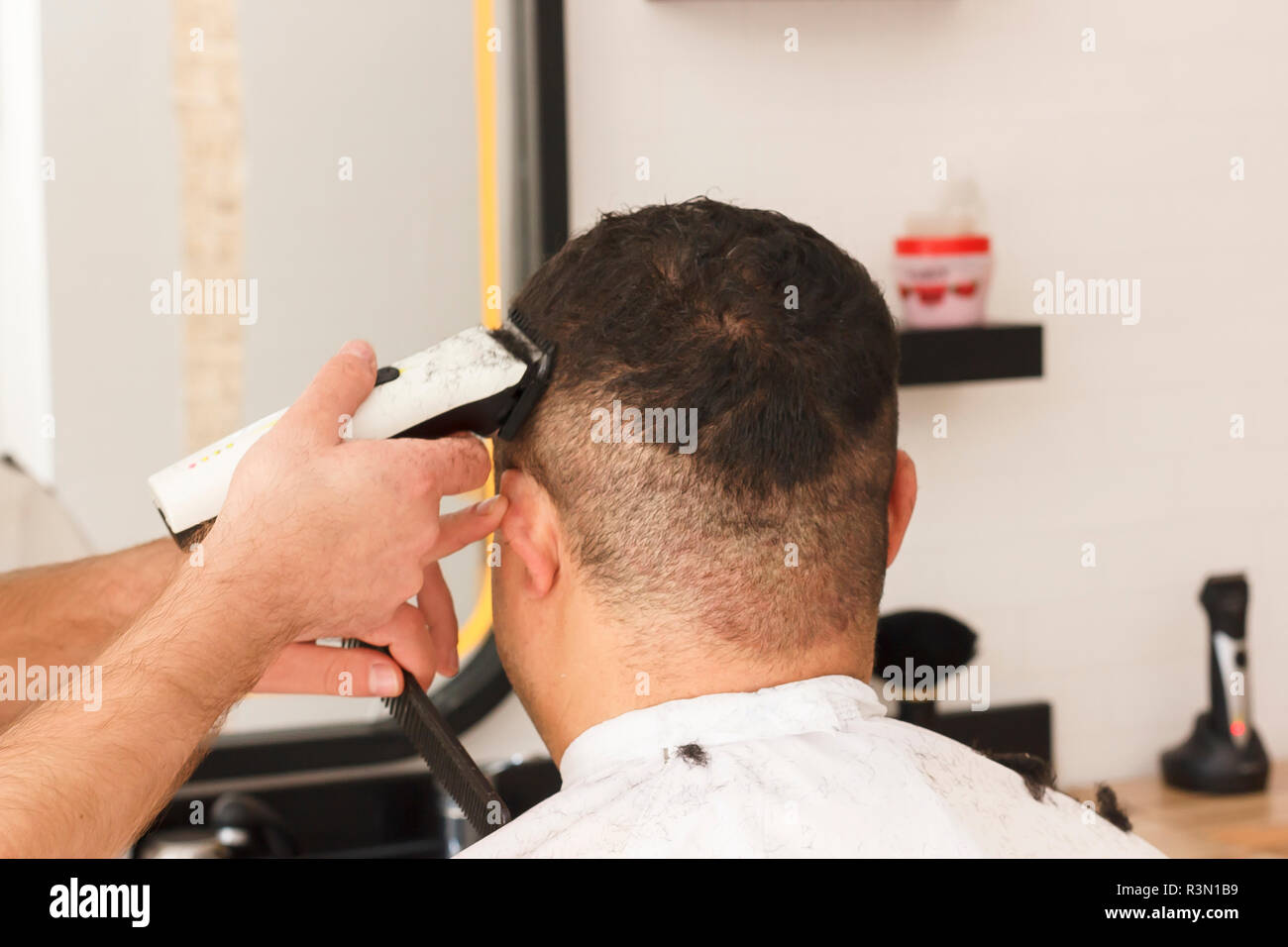 Back view of man getting short hair trimming at barber shop with a clipper machine Stock Photo - Alamy Back view of man getting short hair trimming at barber shop with a clipper machine Stock Photo - Alamy
