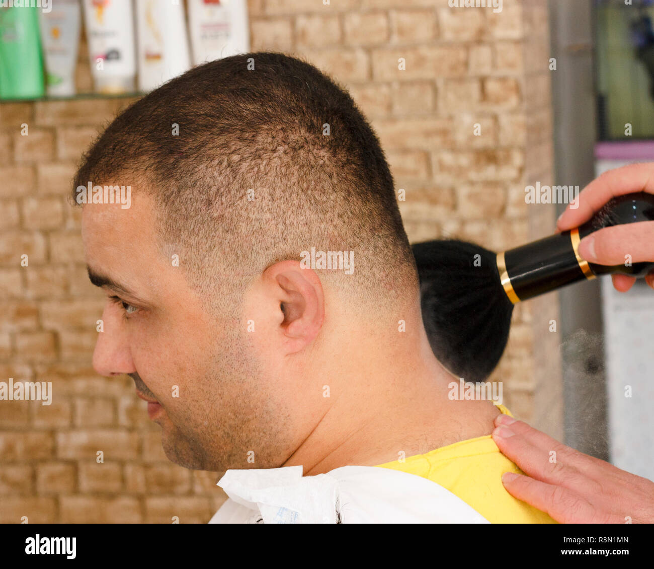 Man Getting Short Hair Trimming At Barber Shop Stock Photo