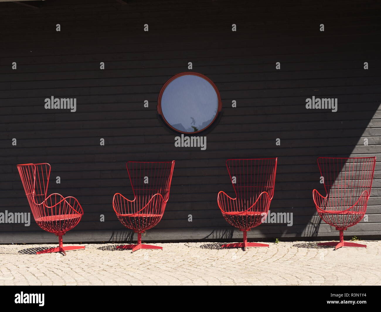 some designer chairs in front of a black background Stock Photo