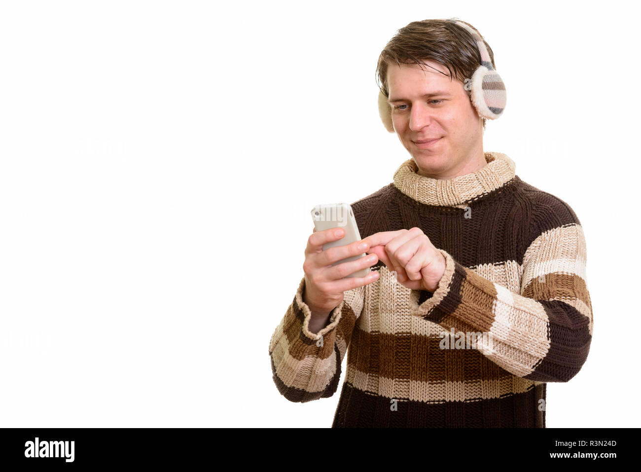 Portrait of handsome Caucasian man using mobile phone Stock Photo