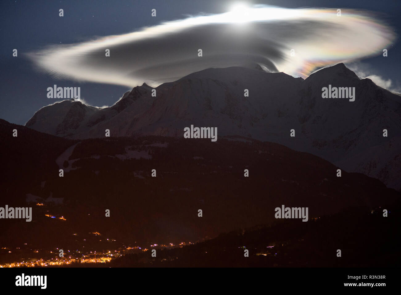 Mont Blanc massif with cap cloud lit by the moon, Saint-Gervais-les-Bains, Haute-Savoie, France, april 1st, 2018 Stock Photo