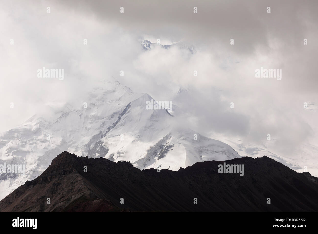 Pamir mountains with peak Lenin, which is shrouded by clouds, Kyrgyzstan Stock Photo