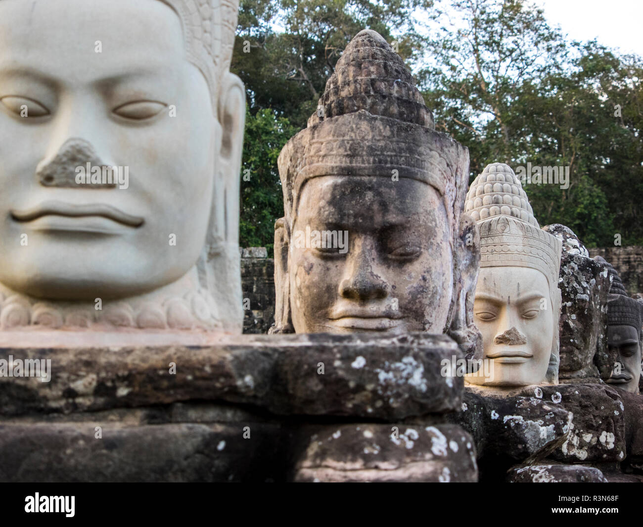 Cambodia, Angkor Watt, Siem Reap, Daemon heads on the gods and daemon bridge at the South gate of Angkor Thom Stock Photo