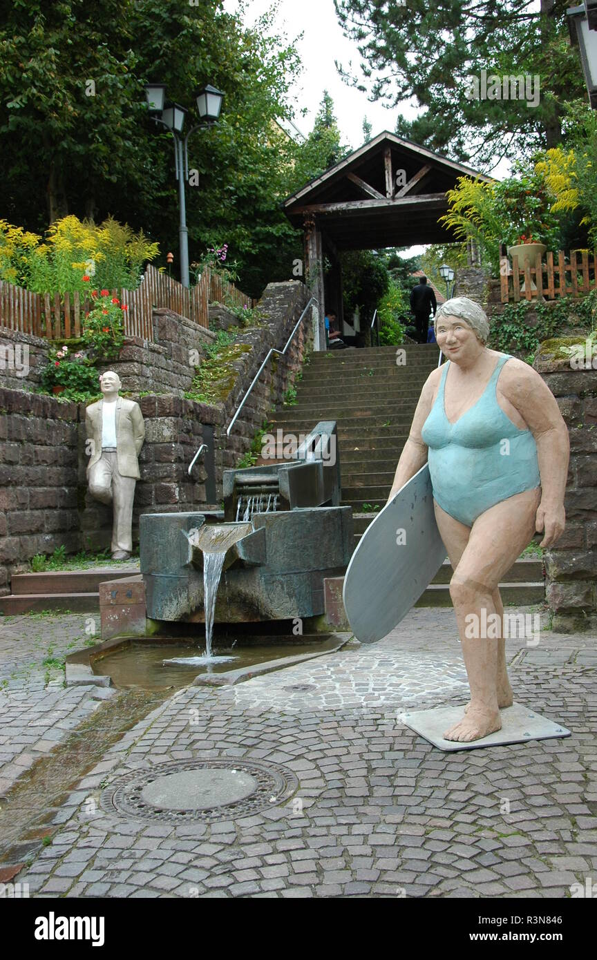 woman with surfboard at the candelabrun in mosbach Stock Photo