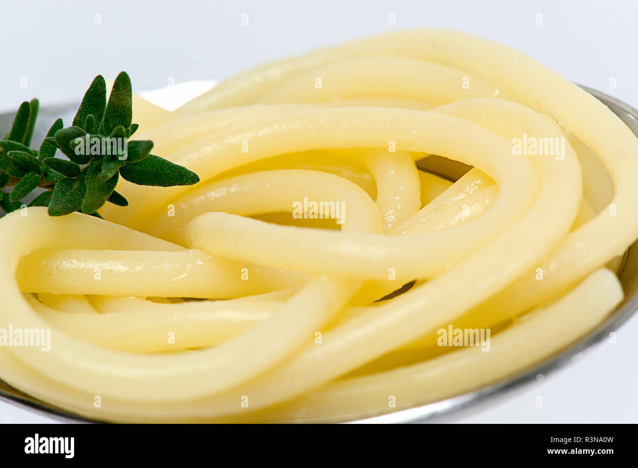 spaghetti noodle on a spoon and fork Stock Photo Alamy