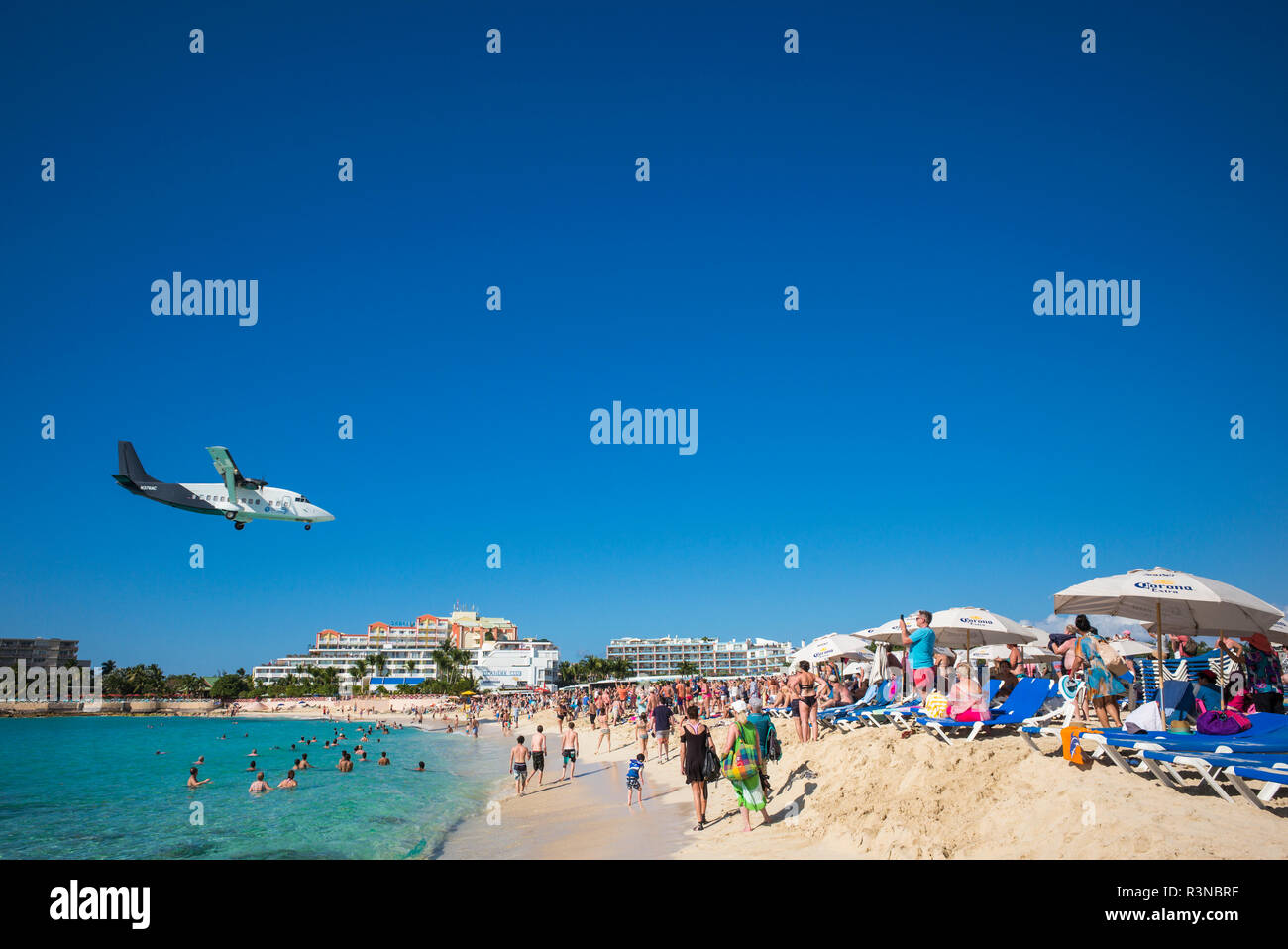 Sint Maarten. Maho Bay Beach view of aircraft landing at Princess Juliana International Airport Stock Photo