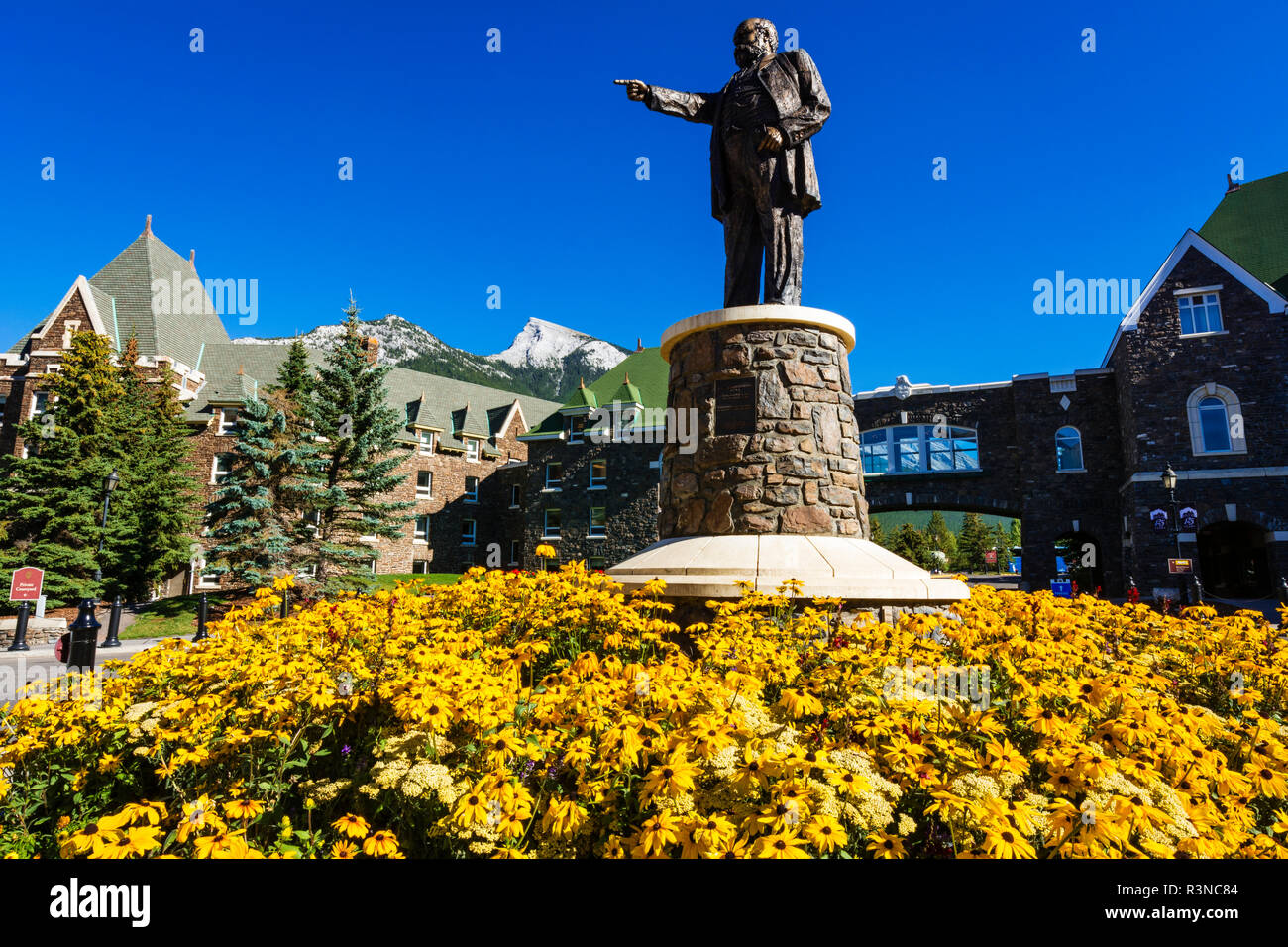 William Cornelius Van Horne statue and flowers at the Banff Springs Hotel, Banff National Park