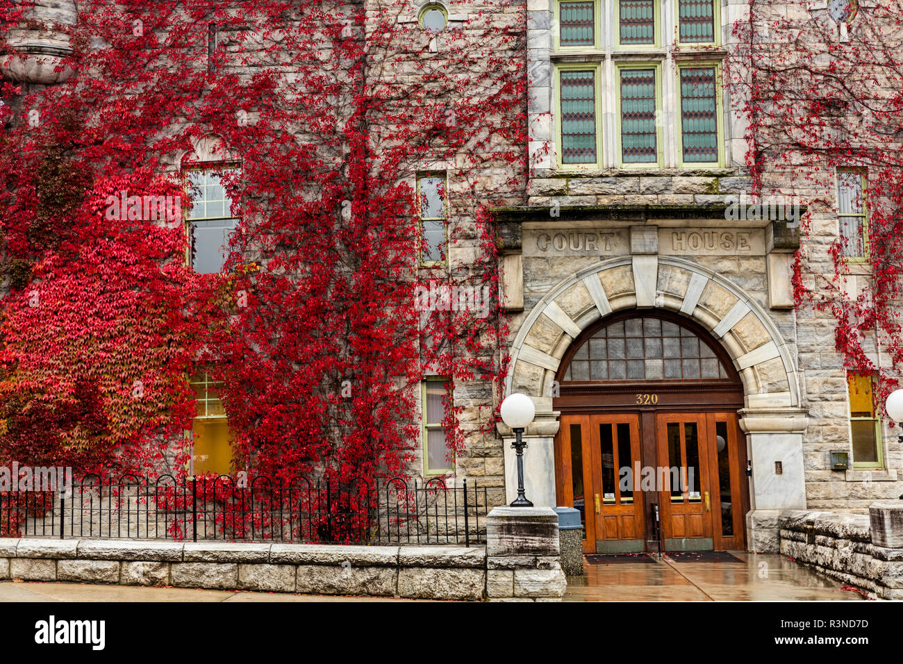 Red ivy cover historic Courthouse in Nelson, British Columbia, Canada Stock Photo