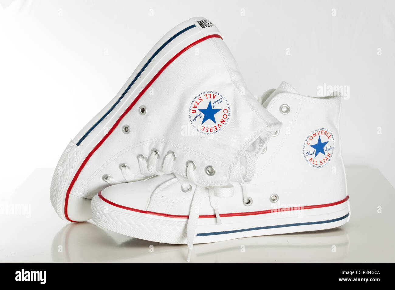 ESKISEHIR, TURKEY - APR 29, 2010: White Converse sneakers on white desk  Stock Photo - Alamy