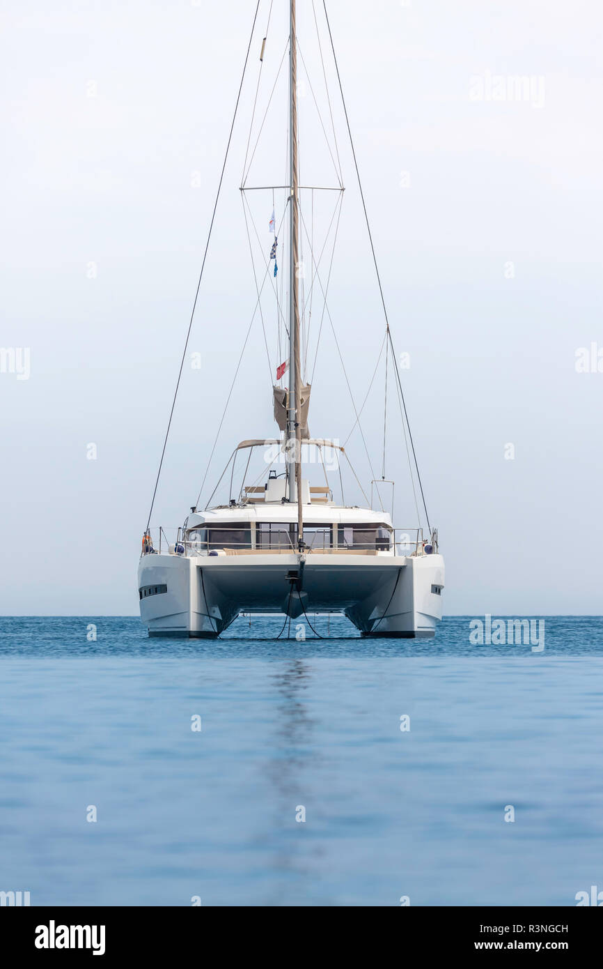 A single catamaran in the open sea. Sailboat in the Mediterranean Sea