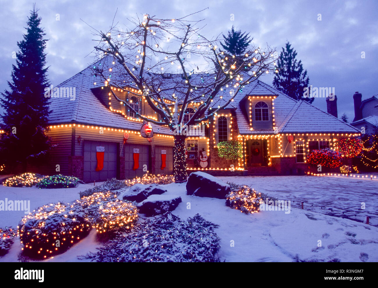 Home lit with Christmas lights. Stock Photo