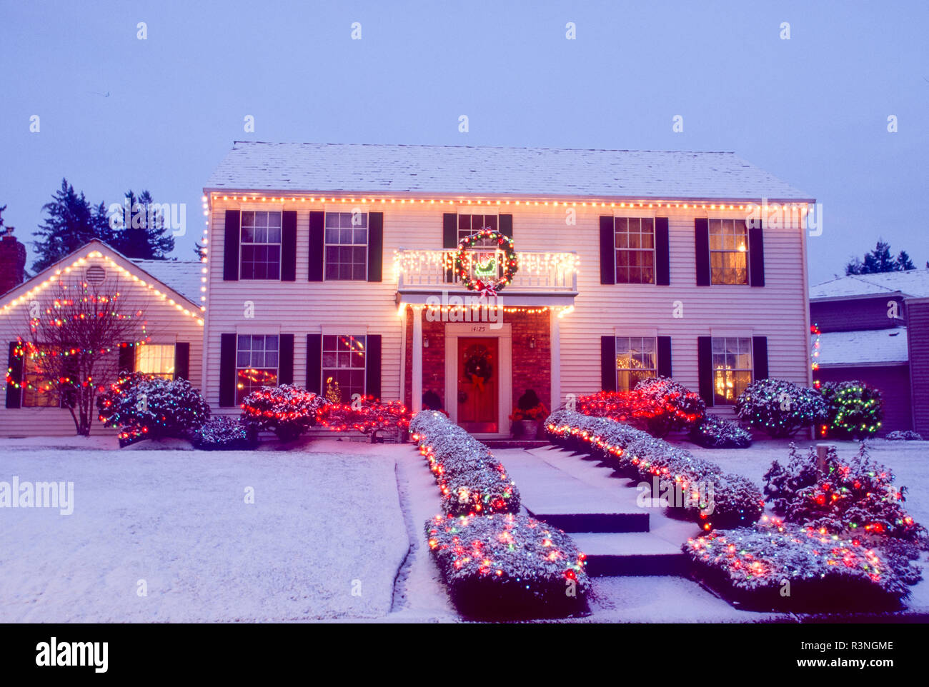 Home lit with Christmas lights. Stock Photo