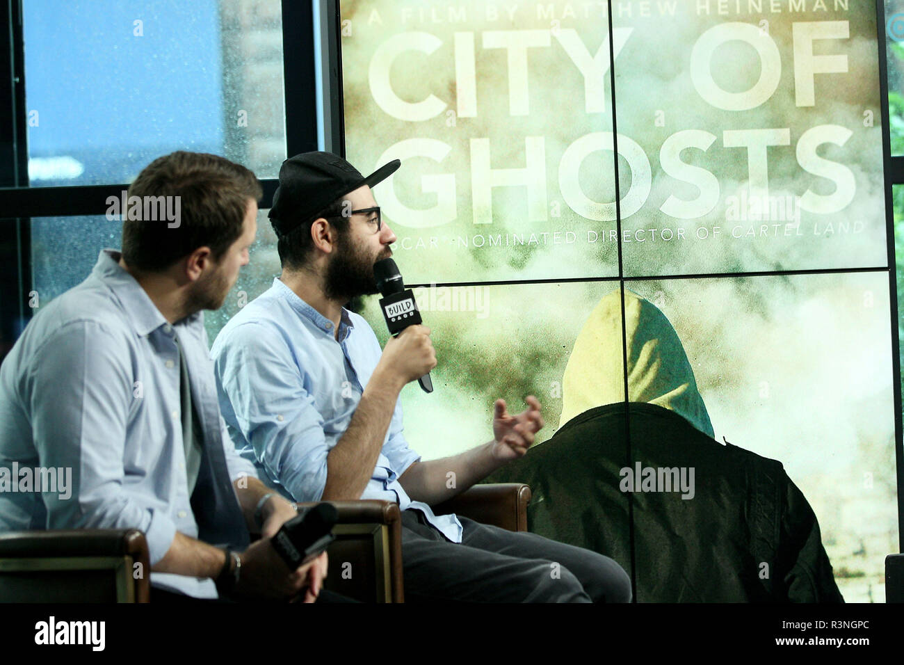 NEW YORK, NY - JULY 07:  Producer/Director Matthew Heineman and journalist Abdalaziz 'Aziz' Alhamza visit Build to discuss the new film 'City Of Ghosts' at Build Studio on July 7, 2017 in New York City.  (Photo by Steve Mack/S.D. Mack Pictures) Stock Photo