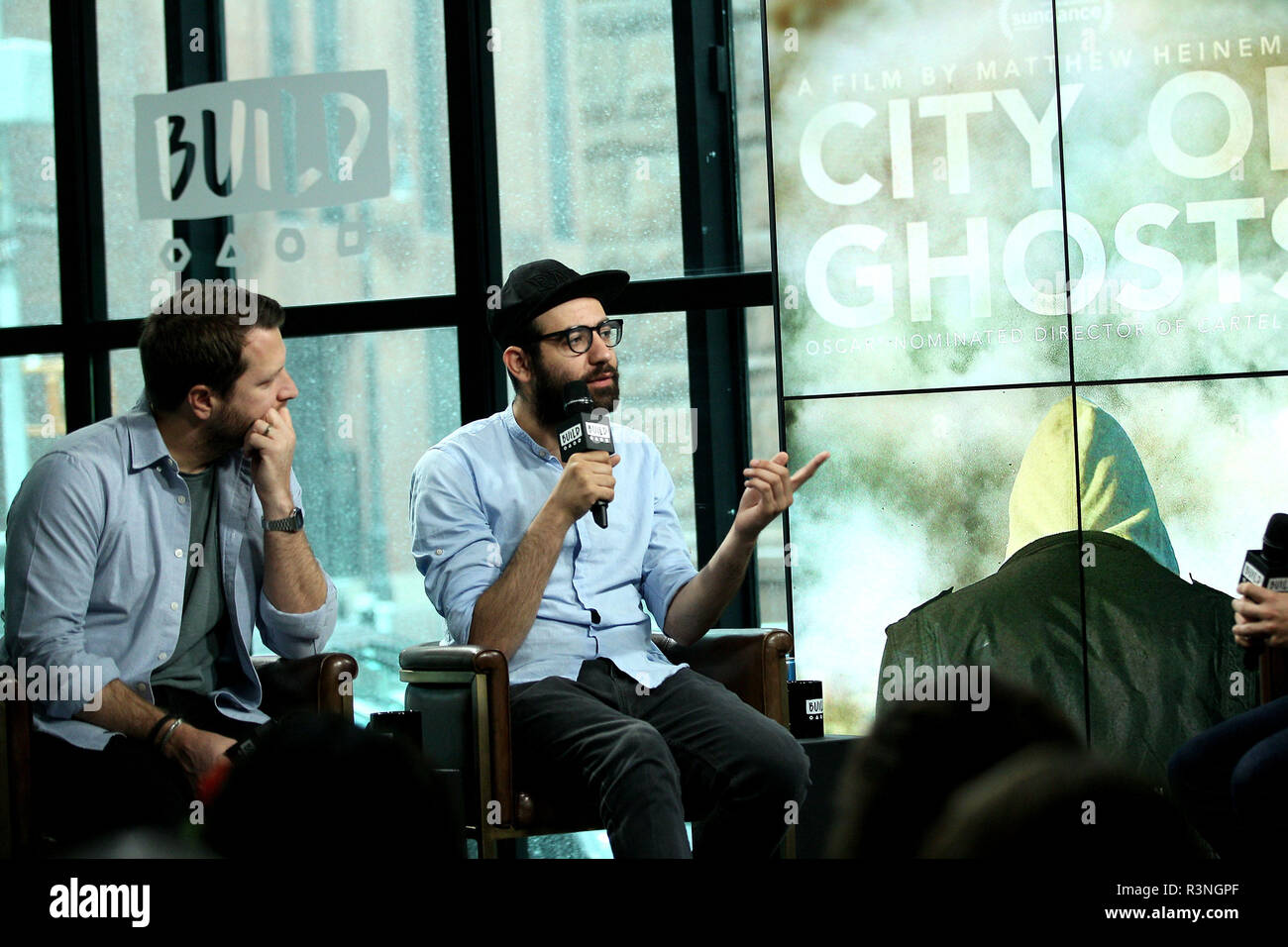 NEW YORK, NY - JULY 07:  Producer/Director Matthew Heineman and journalist Abdalaziz 'Aziz' Alhamza visit Build to discuss the new film 'City Of Ghosts' at Build Studio on July 7, 2017 in New York City.  (Photo by Steve Mack/S.D. Mack Pictures) Stock Photo