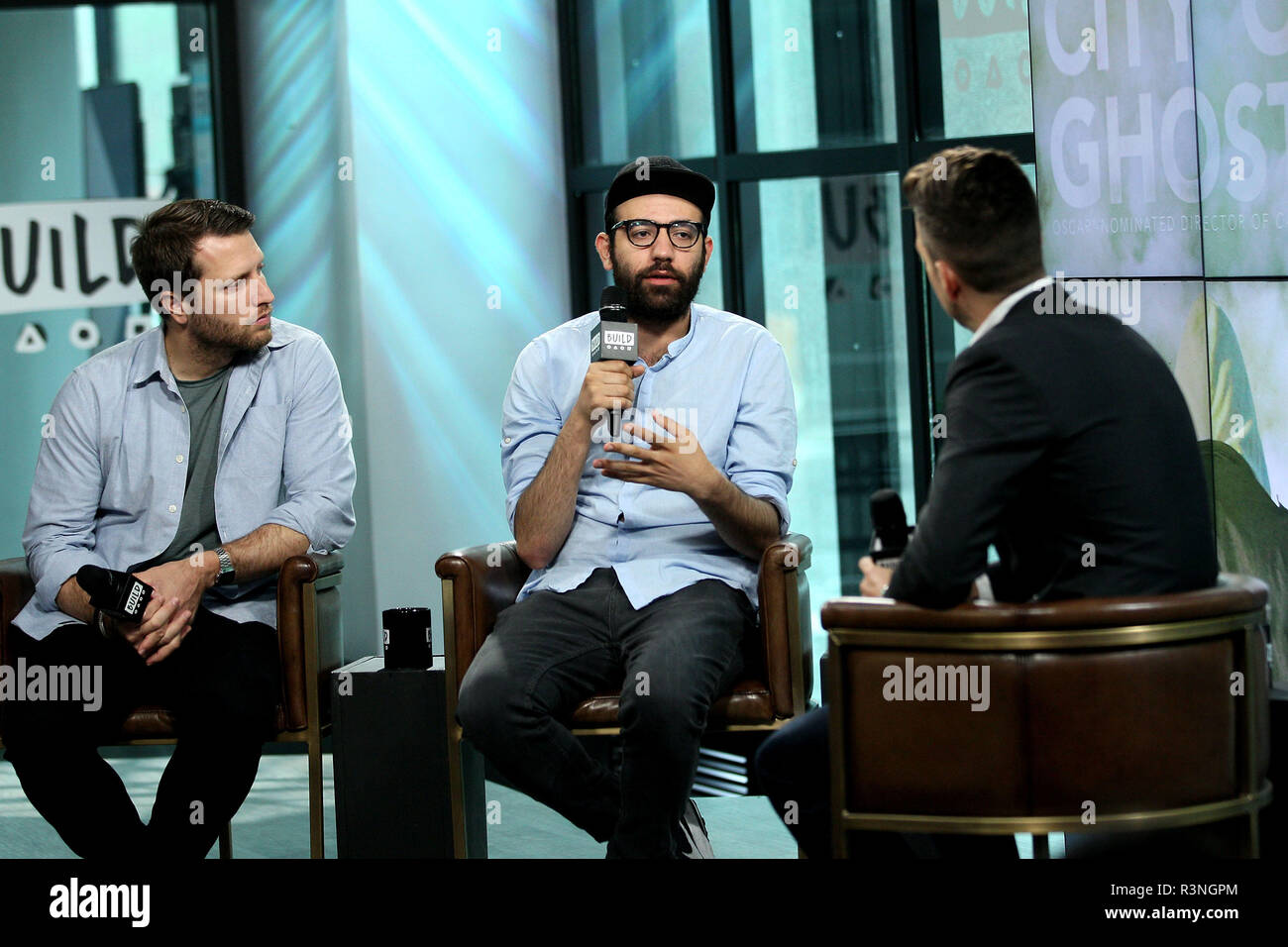 NEW YORK, NY - JULY 07:  Producer/Director Matthew Heineman and journalist Abdalaziz 'Aziz' Alhamza visit Build to discuss the new film 'City Of Ghosts' at Build Studio on July 7, 2017 in New York City.  (Photo by Steve Mack/S.D. Mack Pictures) Stock Photo