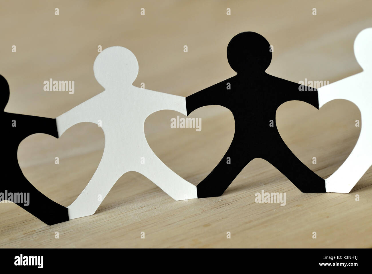 Black and white people chain made of paper - Anti-racism concept Stock Photo