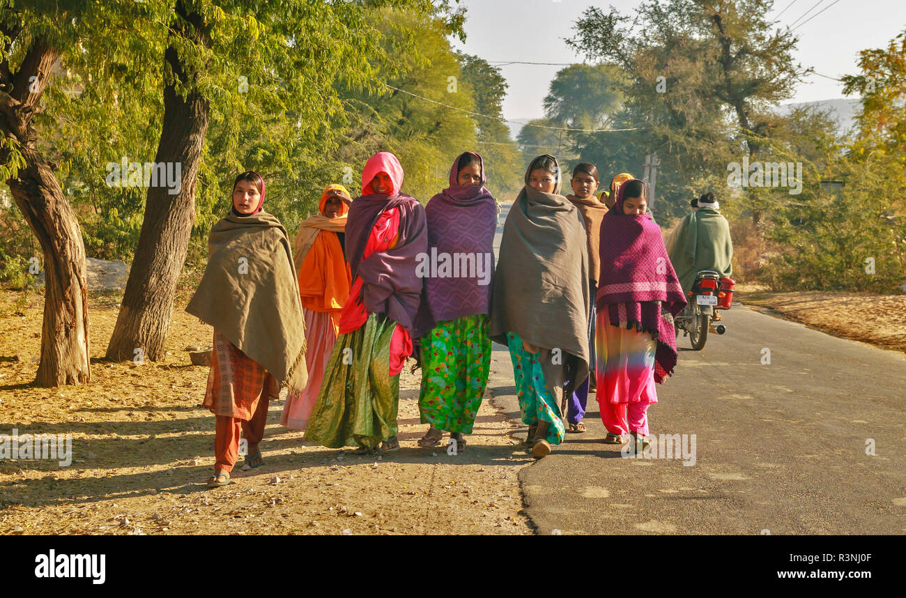 RAJASTHAN JAIPUR  INDIA COLOURFUL GROUP OF WALKERS IN THE STREET Stock Photo