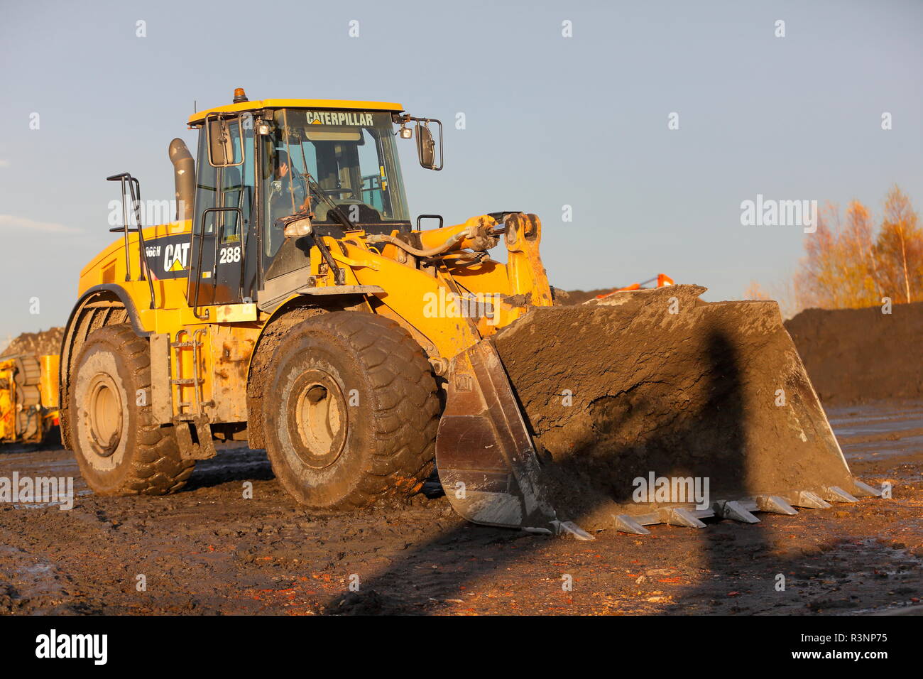 A Caterpillar wheeled loading shovel on the Recycoal,Coal Recycling site in Rossington,Doncaster that are used for loading trucks and freight trains. Stock Photo