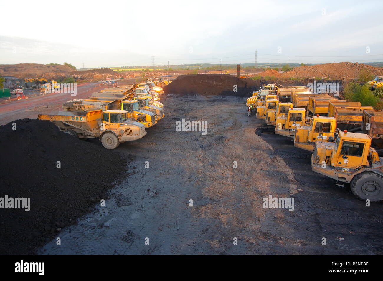 Dump trucks parked up on the Recycoal Coal Recycling site in Rossington,Doncaster which has now been demolished to build new houses. Stock Photo