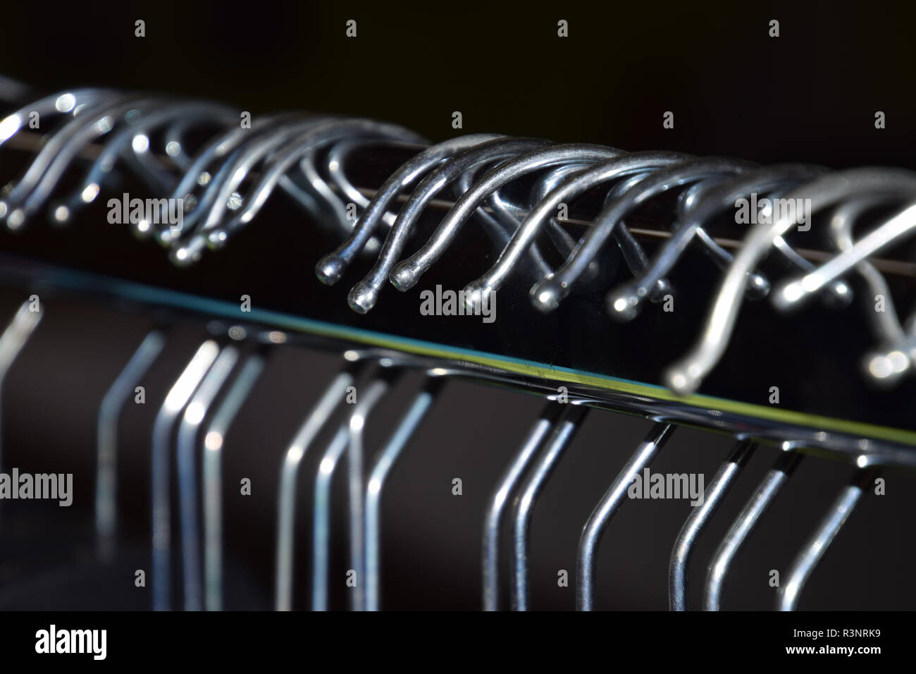 Clothes Rack Macro hangers background, metal clothes hangers on clothes rail macro shot ...
