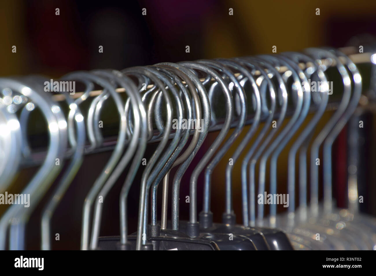 Clothes Rack Macro lots of plastic hangers detail shot, metal clothes hangers on clothes ...