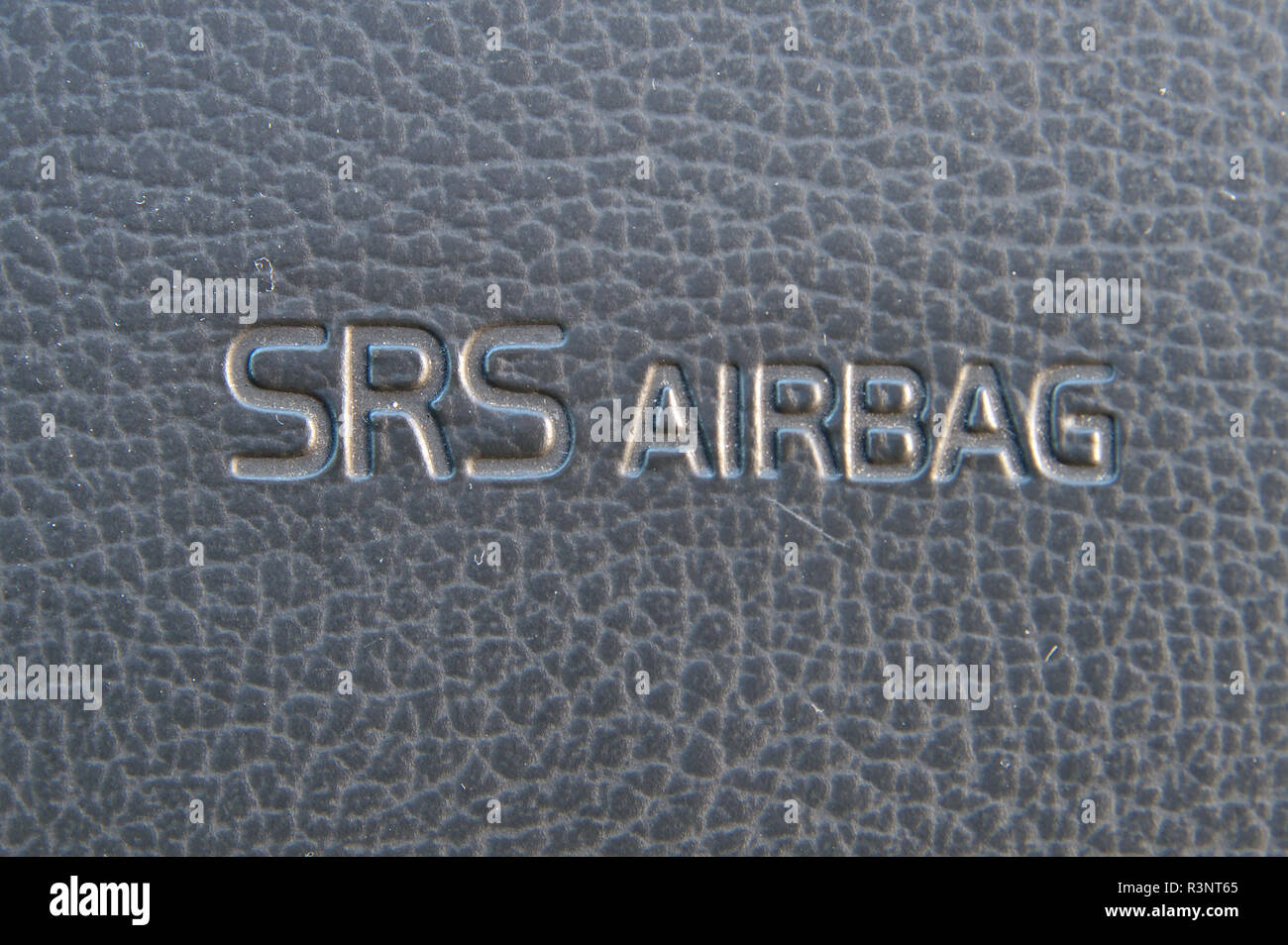 SRS Airbag warning text on passanger side dasboard of a car. Stock Photo