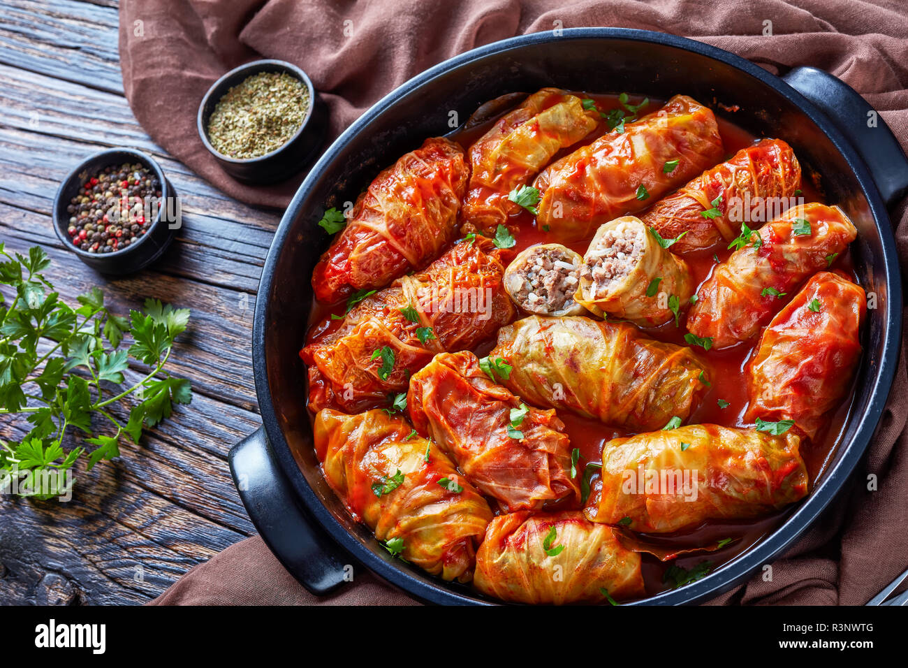overhead view of cabbage rolls stuffed with ground beef and rice and baked to perfection with a tangy tomato sauce in dutch oven, view from above, clo Stock Photo