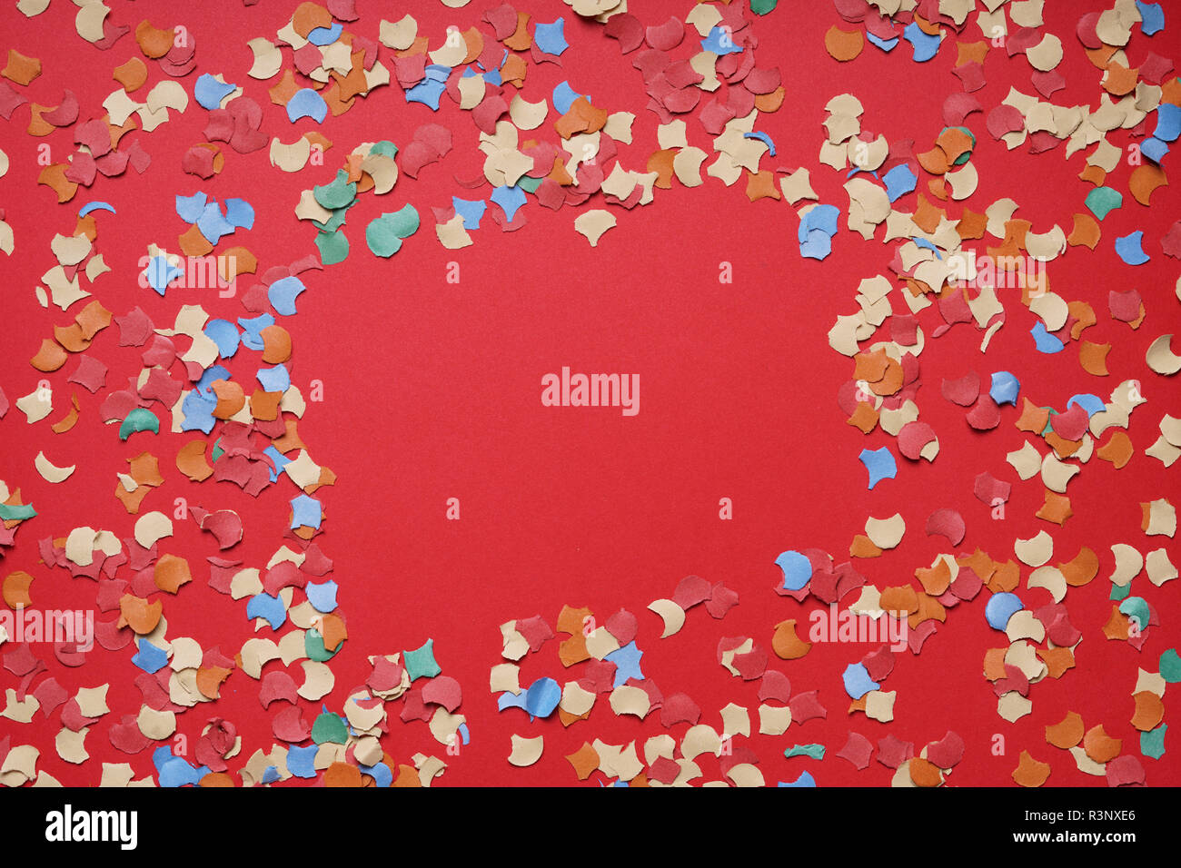 confetti frame on red paper background Stock Photo