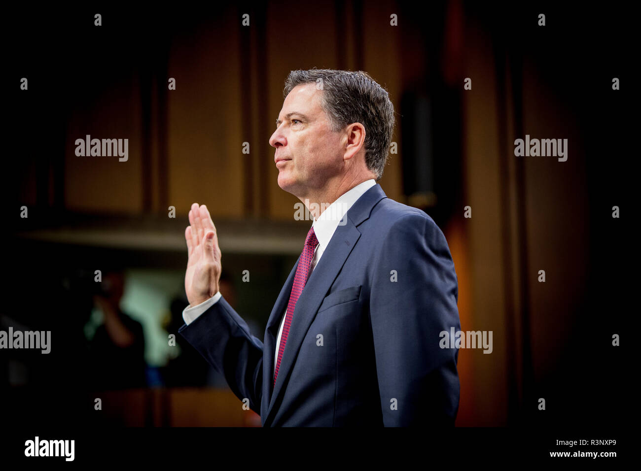 Former FBI Director James Comey testifies in front of the US Senate Intelligence Committee as part of the Committees investigation into what involvement Ruissia had in the election of Donald Trump as the US President. Stock Photo