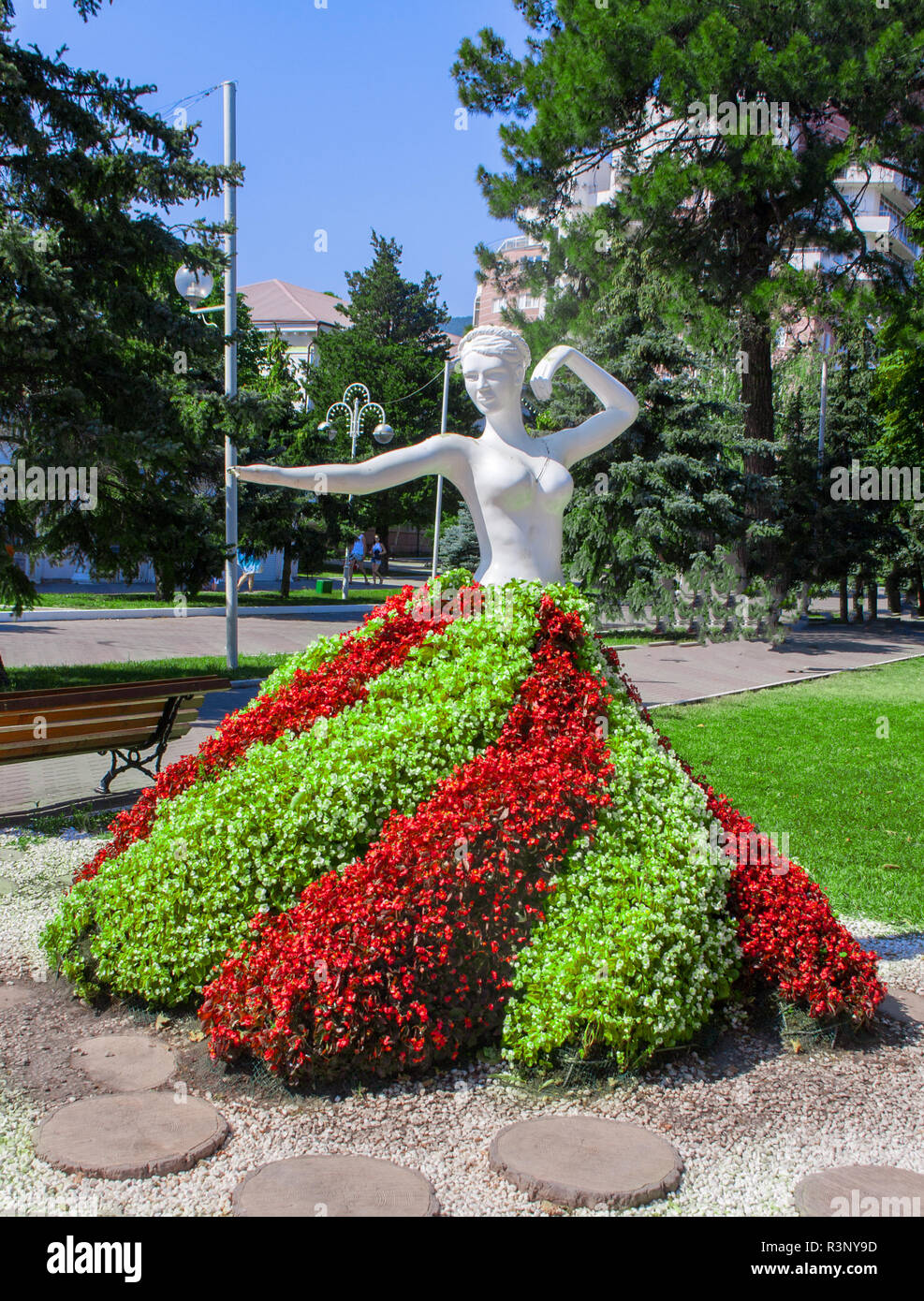 Gelendzhik, Russia - June 2016: original flower bed with statue in the park Stock Photo