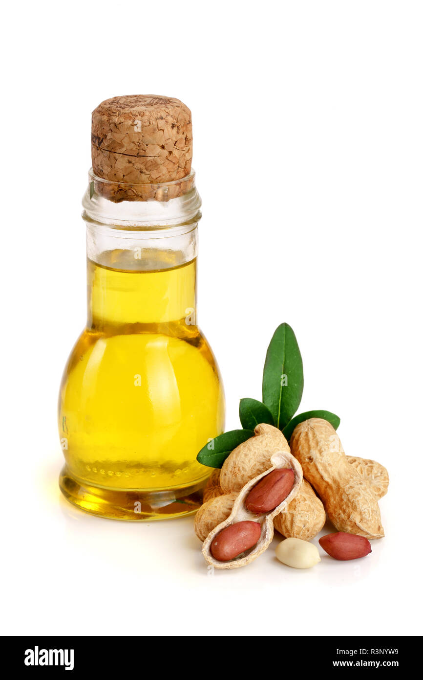 peanut oil in a glass bottle with peanuts Stock Photo Alamy
