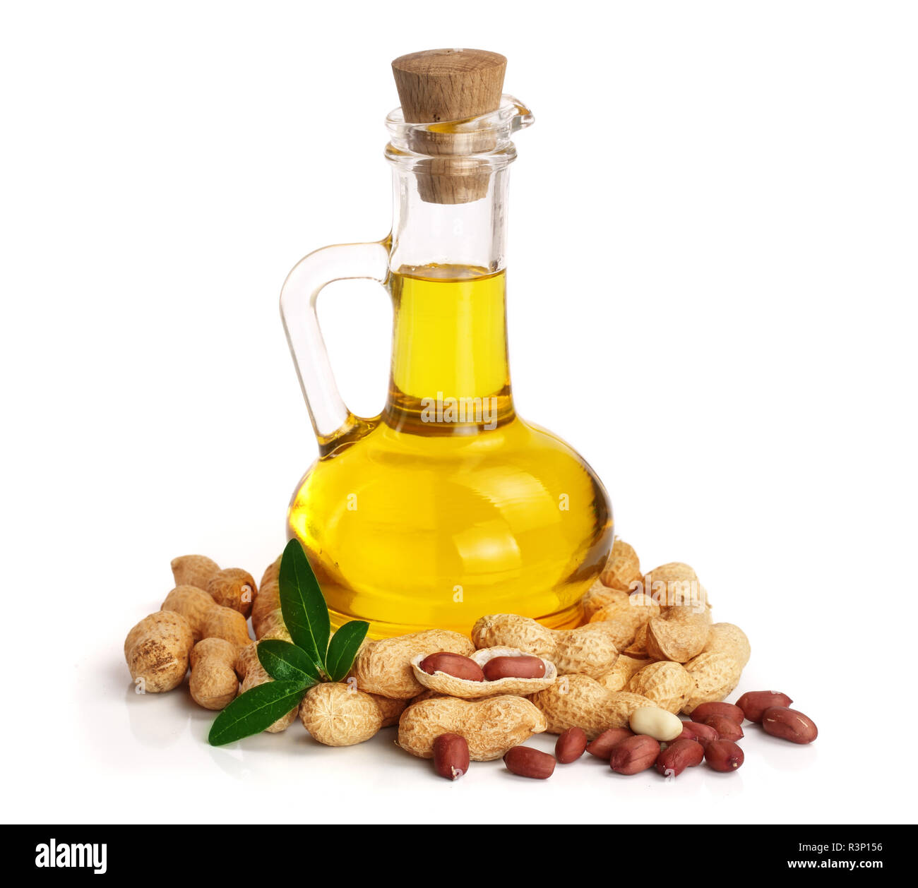 peanut oil in a glass bottle with peanuts Stock Photo Alamy