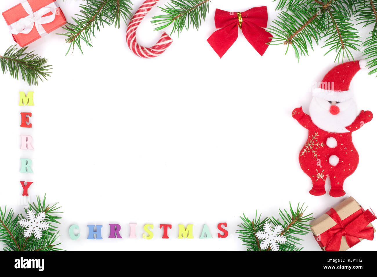 merry christmas inscription in frame made of fir branches isolated on ...