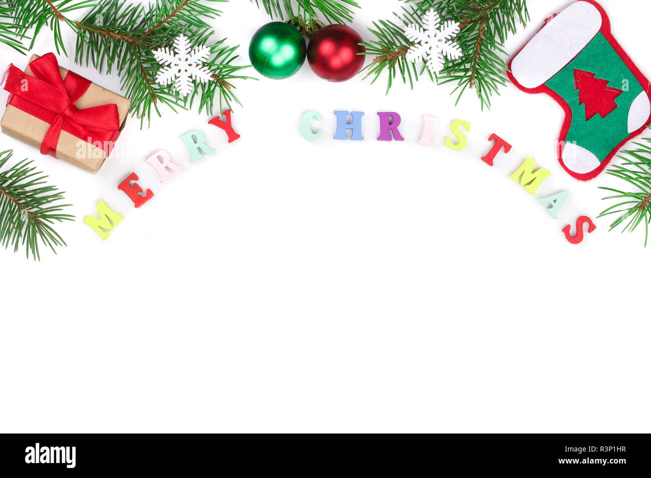 merry christmas inscription in frame made of fir branches isolated on ...