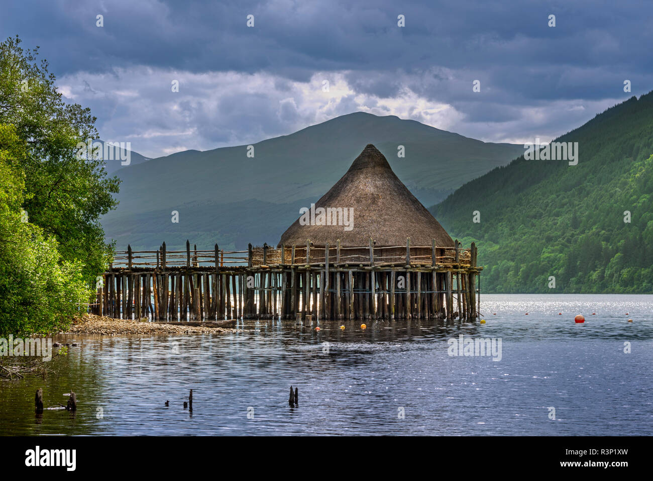 Reconstructed 2500 year old crannog, prehistoric dwelling at the Scottish Crannog Centre on Loch Tay near Kenmore, Perth and Kinross, Scotland, UK Stock Photo