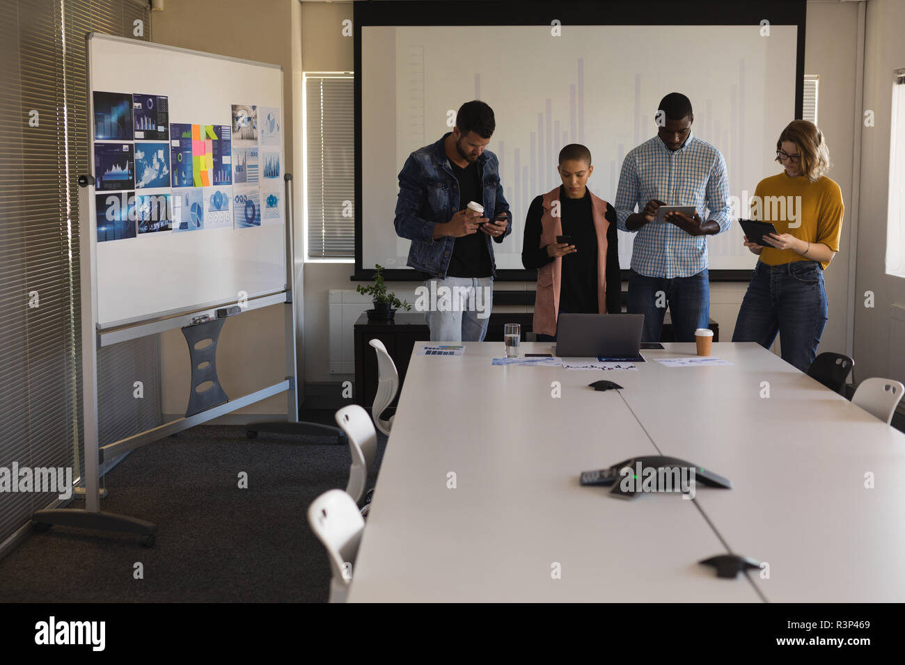 Executives working in conference room at office Stock Photo - Alamy