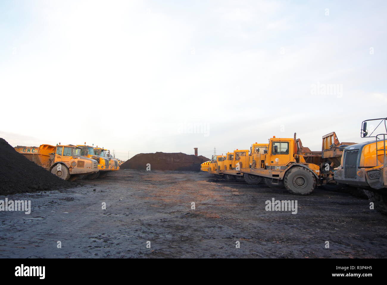 A variety of articulated dump trucks on the Recycoal Coal Recycling Plant in Rossington,Doncaster which has now been demolished to build new homes. Stock Photo