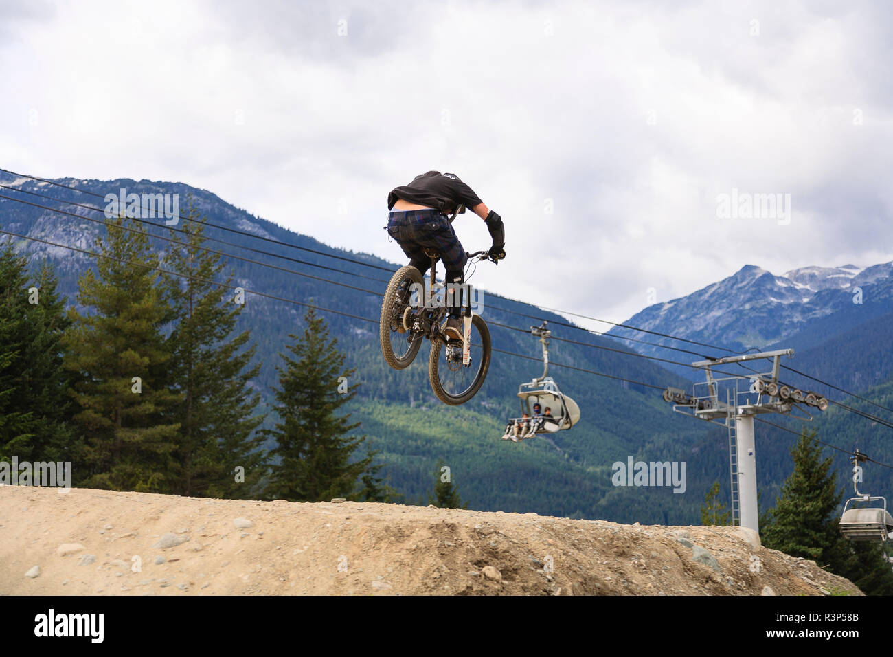 Mountain biker catching air, Whistler Mountain, British Columbia, Canada Stock Photo