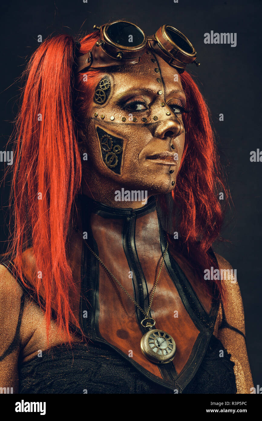 Portrait of a woman steampunk robot, red hair Stock Photo - Alamy