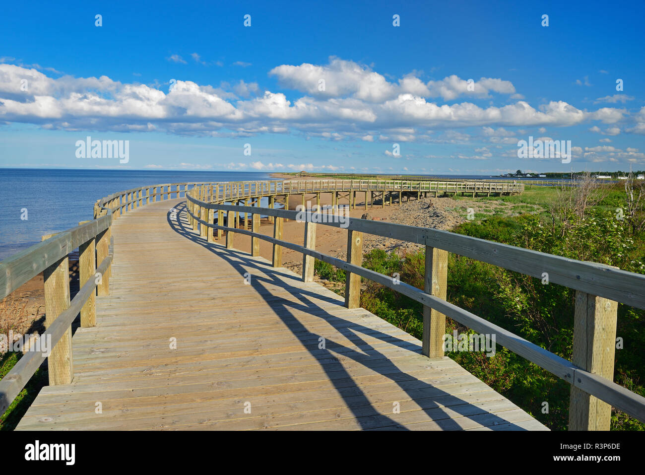 Canada, New Brunswick, Bouctouche. Boardwalk next to ocean Stock Photo