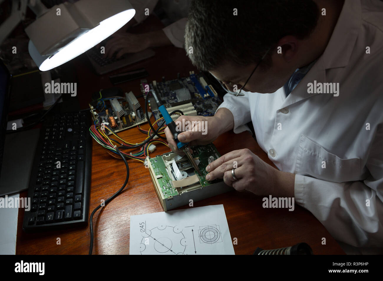Robotics engineer assembling circuit board at desk Stock Photo Alamy