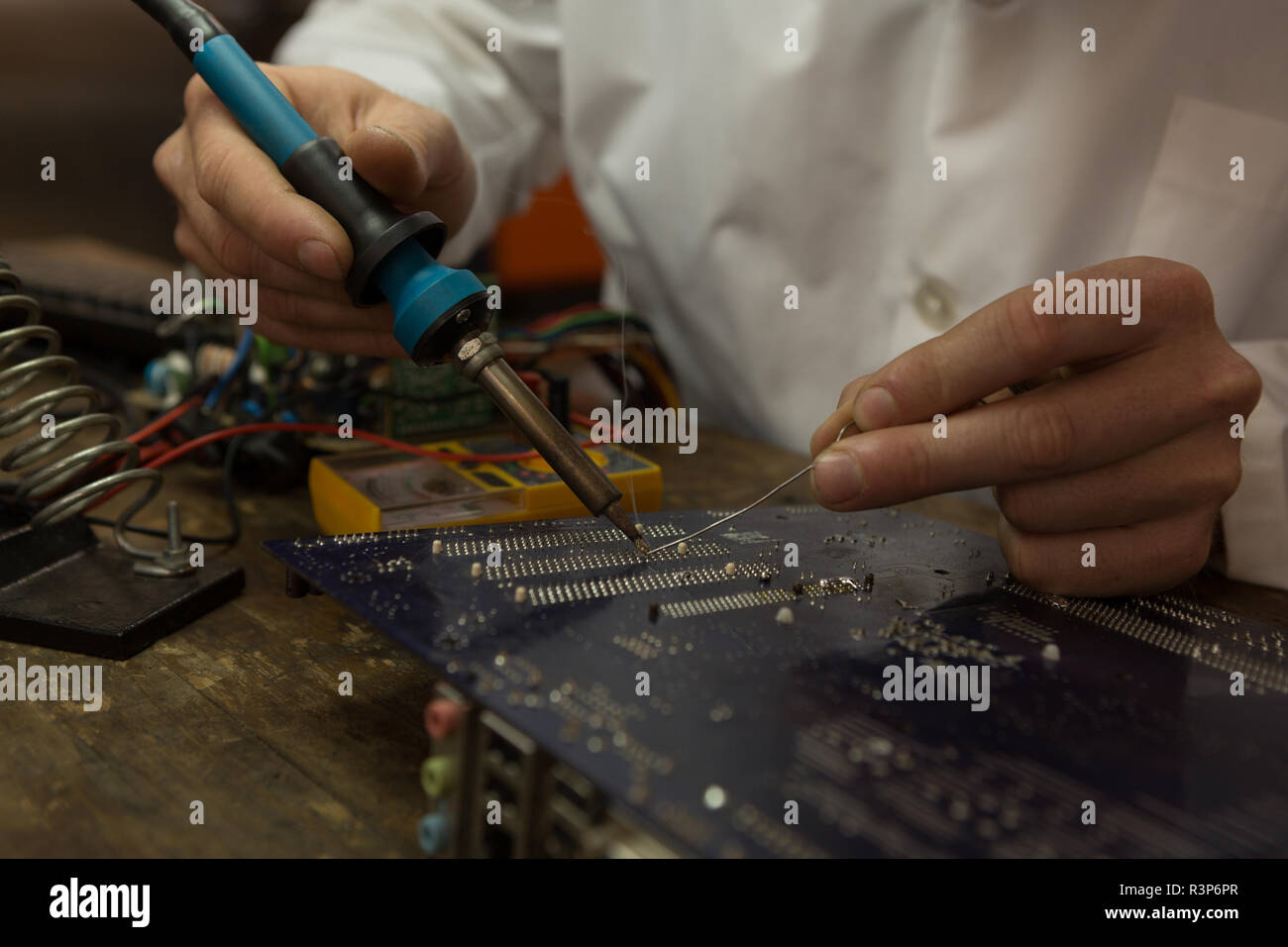 Robotics engineer assembling circuit board at desk Stock Photo Alamy