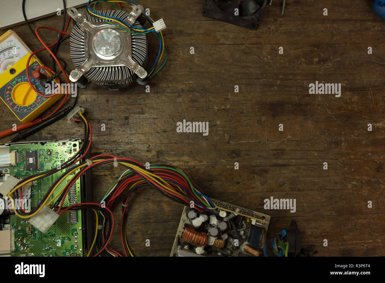Circuit board and multimeter on table Stock Photo