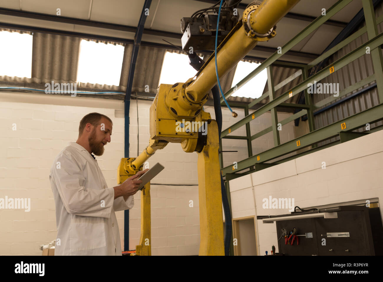 Robotics engineer using digital tablet Stock Photo
