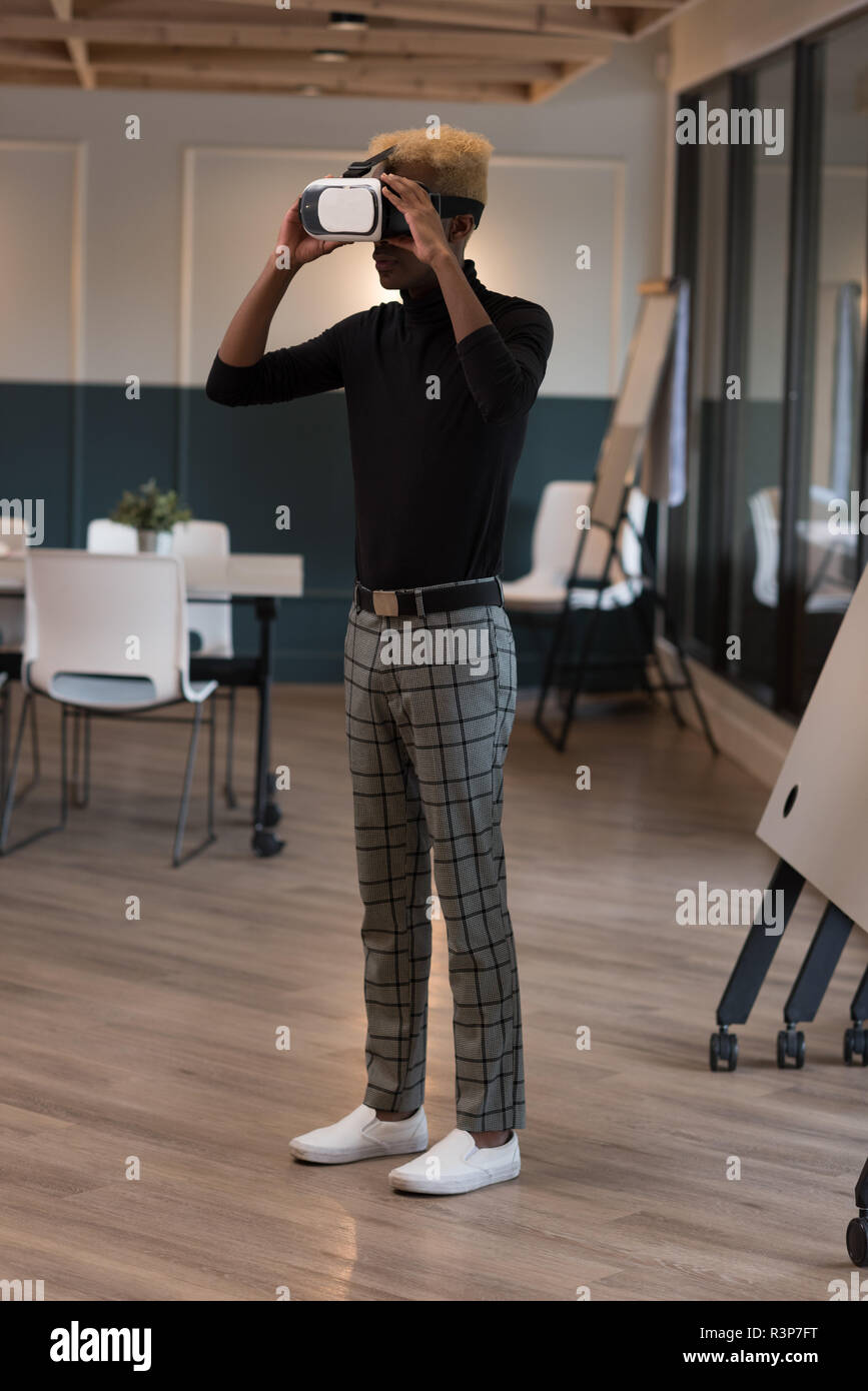 Businessman using virtual reality headset Stock Photo