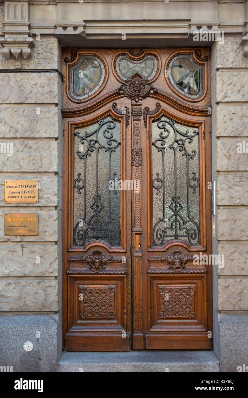 France, Alsace, Colmar. Ornate wood and glass door. Stock Photo